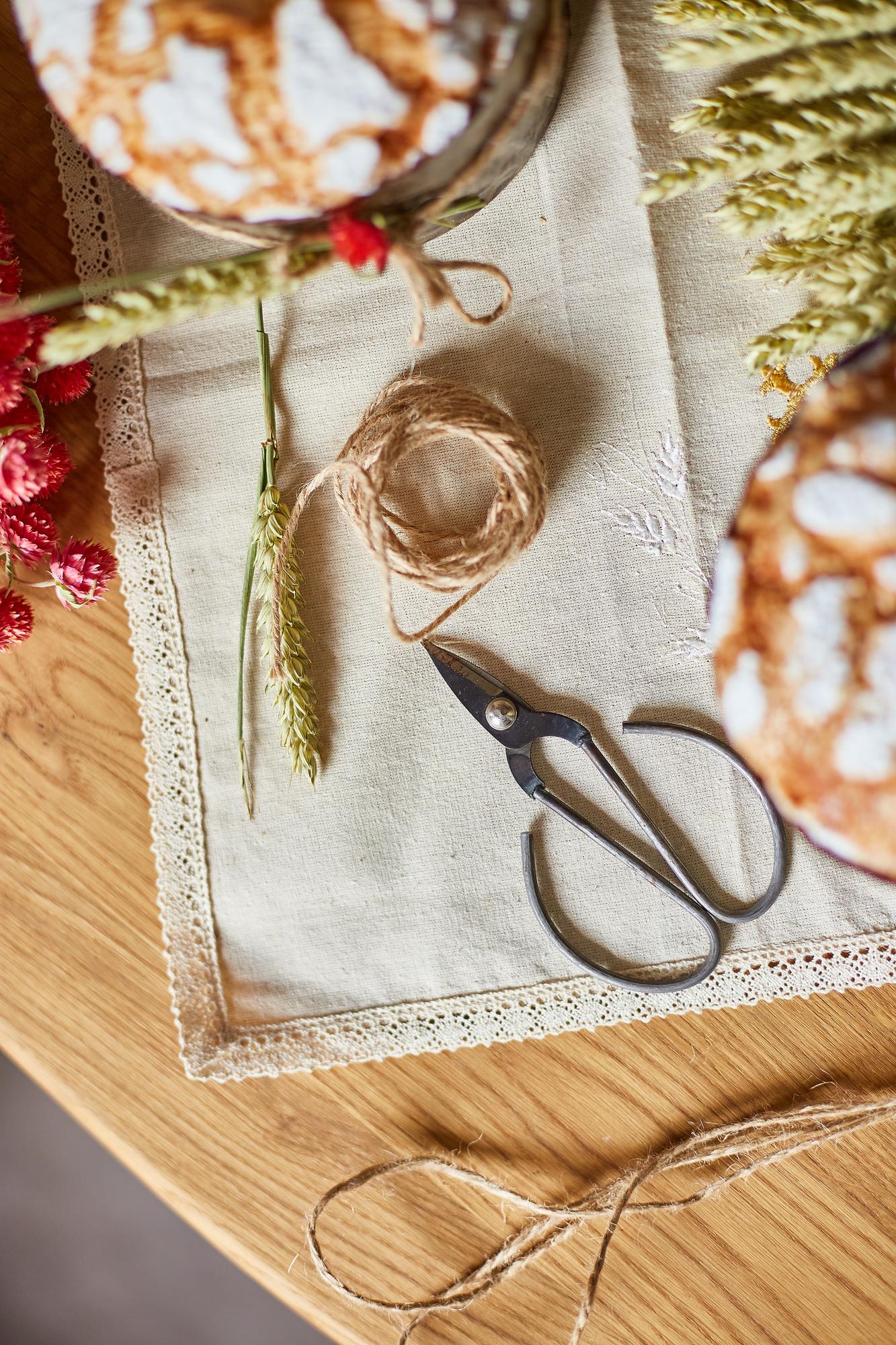 linen napkin with embroidered botanical motif