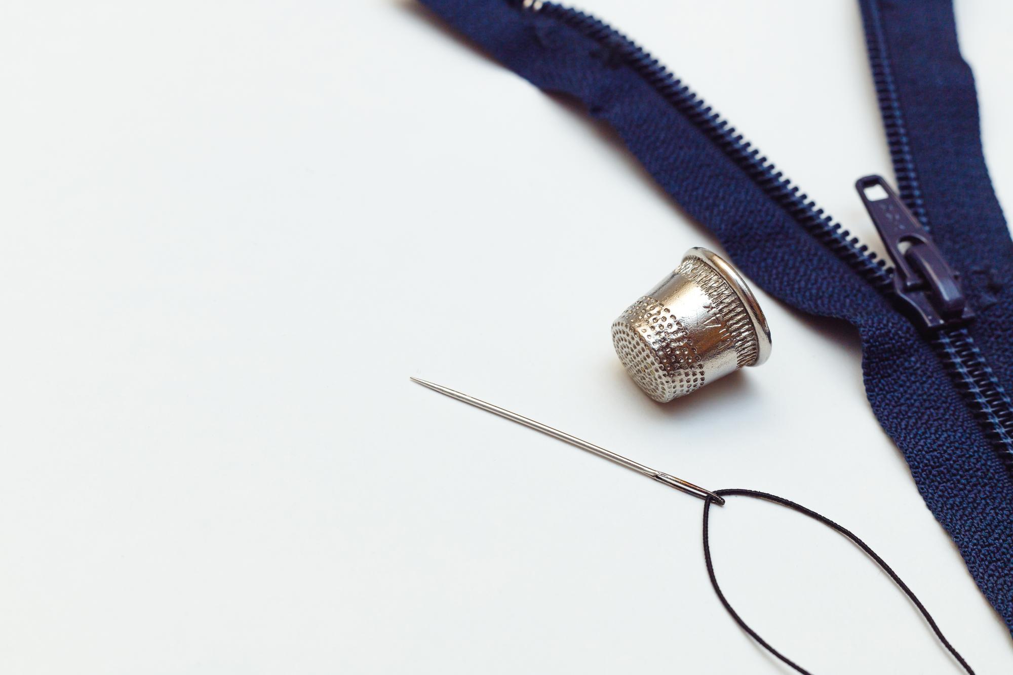 embroidered jacket cuff with metallic thread accents
